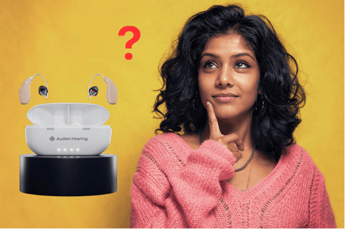 Woman with brown skin thinking about the Audien ION Pro with a yellow background